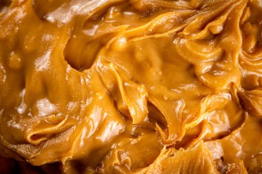 Fresh peanut butter. Macro background. The texture of peanut butter. High quality photo