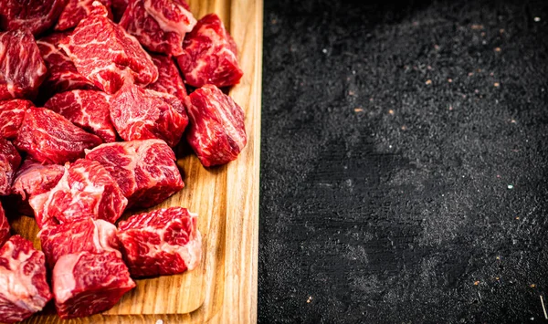 Raw Pieces Beef Wooden Cutting Board Black Background High Quality — стоковое фото