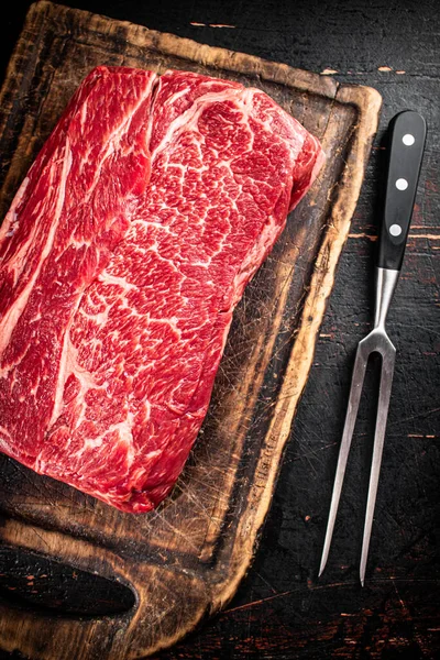 Raw Beef Cutting Board Fork Rustic Dark Background High Quality — ストック写真