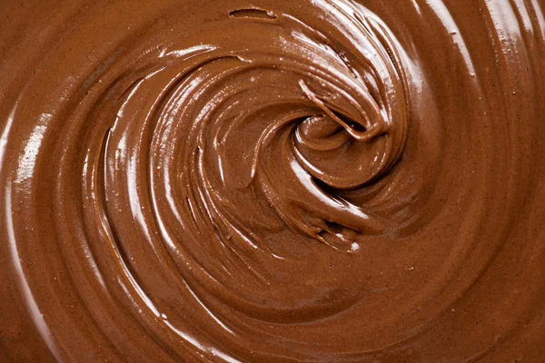 Fresh hazelnut butter. Macro background. The texture of hazelnut butter . High quality photo