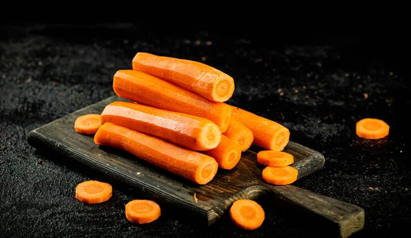 Fresh Carrots Cutting Board Black Background High Quality Photo — Fotografia de Stock