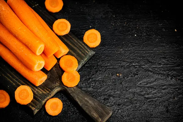 Fresh Carrots Cutting Board Black Background High Quality Photo — Fotografia de Stock