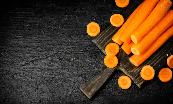 Fresh Carrots Cutting Board Black Background High Quality Photo — Φωτογραφία Αρχείου