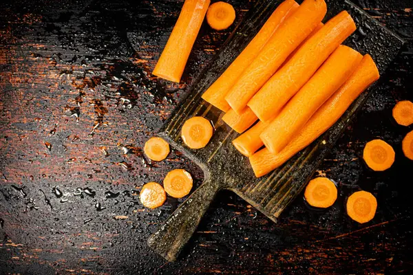 Pieces Whole Fresh Carrots Cutting Board Dark Background High Quality — Φωτογραφία Αρχείου