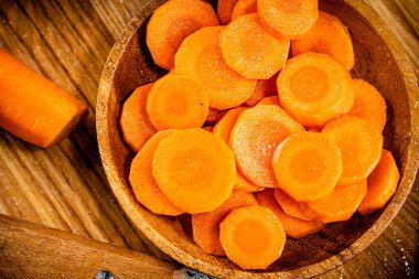 Round pieces of fresh carrots on a plate. Macro background. High quality photo