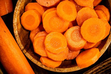 Round pieces of fresh carrots on a plate. Macro background. High quality photo