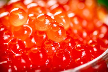 Grains of red caviar. Red caviar texture. High quality photo