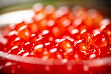 Grains of red caviar. Macro background. High quality photo