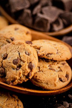 Homemade cookies with chocolate. Against a dark background. High quality photo