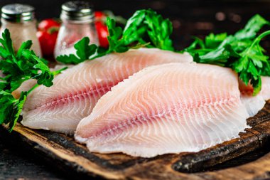 Fresh fish fillet on a cutting board. Macro background. High quality photo