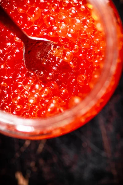 Red Caviar Open Glass Jar Spoon Rustic Dark Background High — Stockfoto