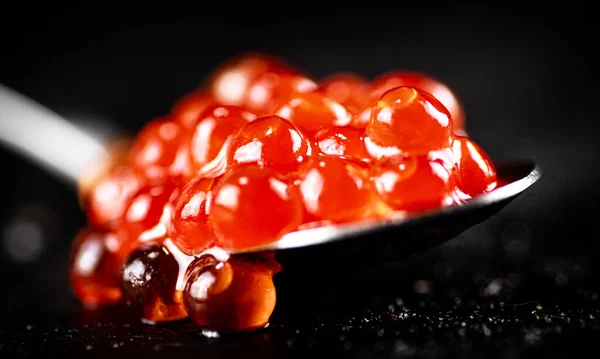 Red Caviar Spoon Table Black Background High Quality Photo — Stockfoto