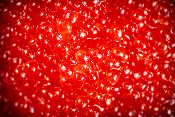 赤いキャビアの穀物 マクロな背景 赤いキャビアの質感 高品質の写真 — ストック写真