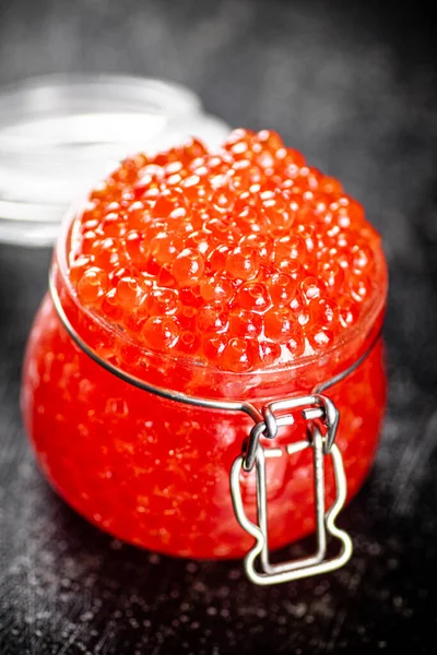 Open Glass Jar Red Caviar Table Black Background High Quality — Fotografia de Stock