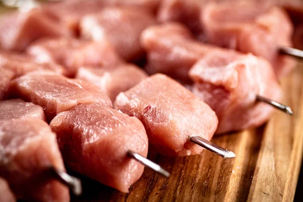 Pork raw kebab on a cutting board. High quality photo