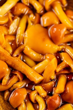 Fragrant marinated mushrooms. Macro background. High quality photo