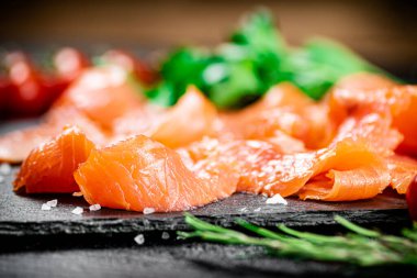Fragrant salted salmon on a stone board. Macro background. High quality photo