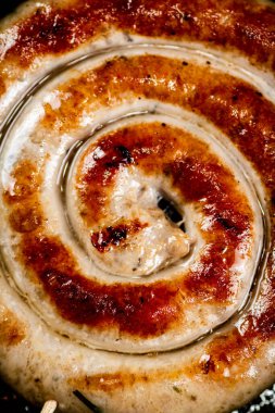 Grilled sausage with crust. Macro background. High quality photo