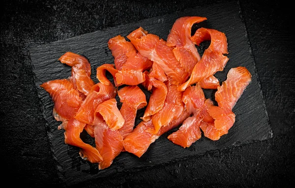 Pieces Salted Salmon Stone Board Black Background High Quality Photo — Stockfoto