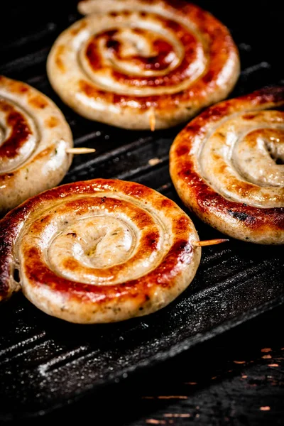 Grilled Sausages Frying Pan Black Background High Quality Photo — Stock fotografie