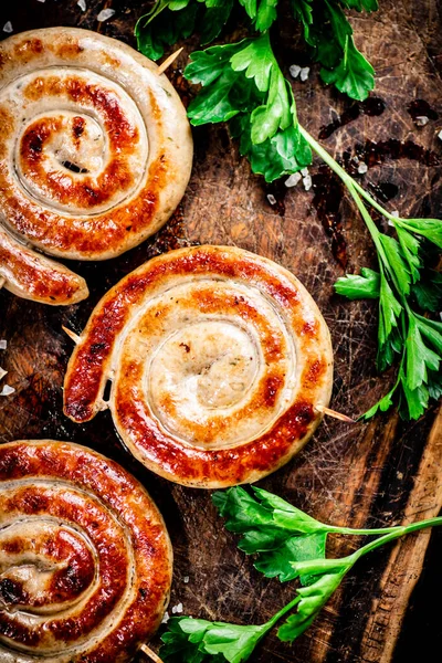 Grilled Sausages Parsley Wooden Background High Quality Photo — Stock fotografie