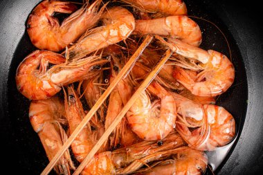 The shrimp are cooked in a pot of water. Macro background. High quality photo