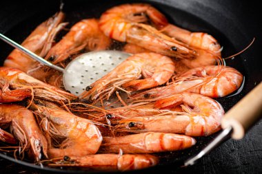 The shrimp are cooked in a pot of water. Macro background. High quality photo