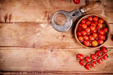 Pickling ripe tomatoes at home. On a wooden background. High quality photo