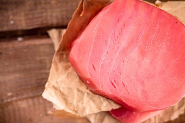 Fresh raw tuna steak on the table. On a wooden background. High quality photo