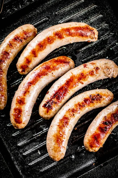 Grilled Sausages Frying Pan Black Background High Quality Photo — Photo
