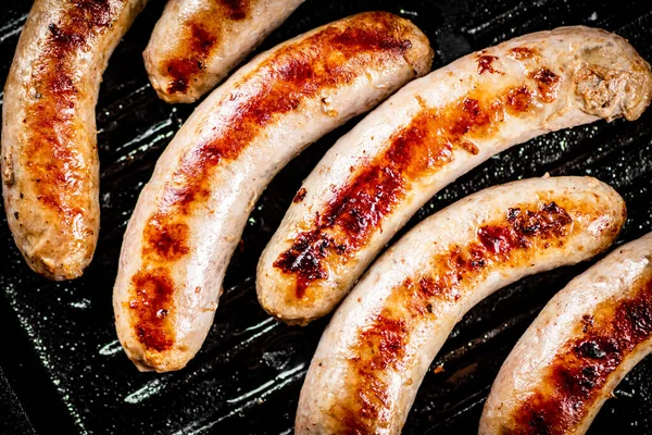 Grilled Sausages Frying Pan Black Background High Quality Photo — Photo