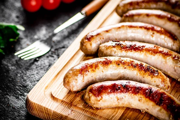 Aromatic Grilled Sausages Cutting Board Black Background High Quality Photo — Photo