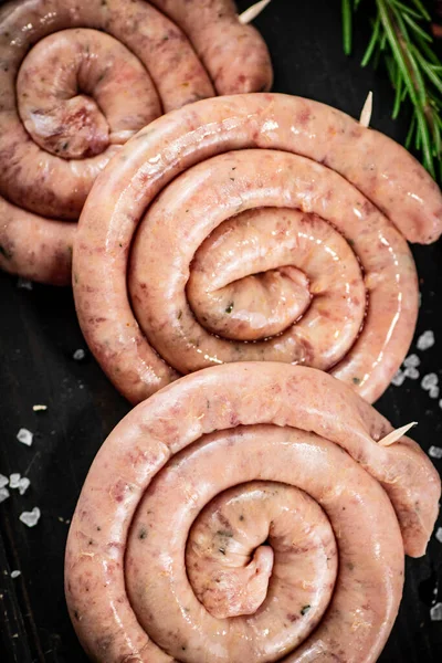 Raw Sausages Sprig Rosemary Rustic Background High Quality Photo — Foto Stock
