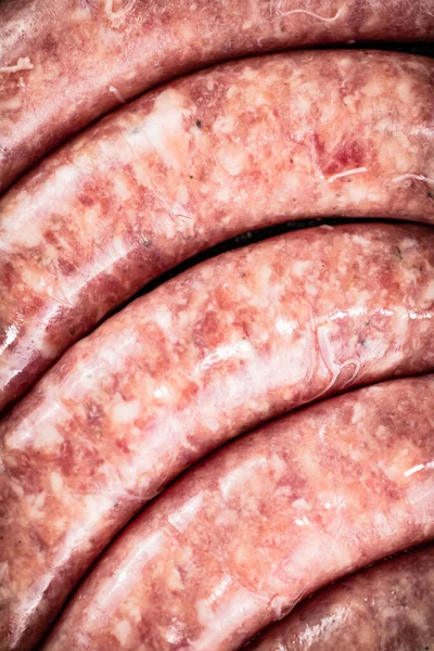 Raw sausages. Macro background. Texture of sausages. High quality photo