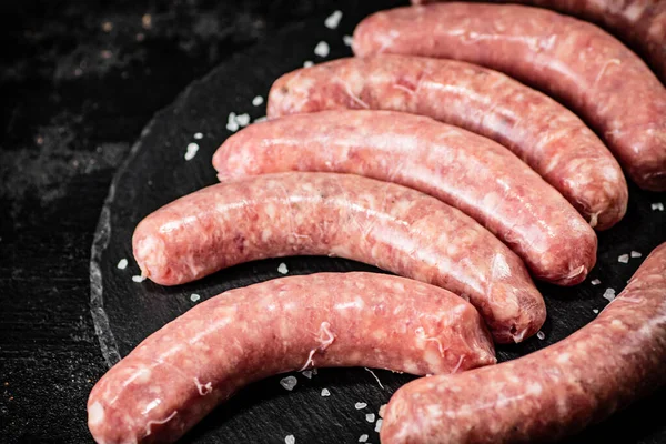 Fresh Raw Sausages Frying Black Background High Quality Photo — Stok fotoğraf