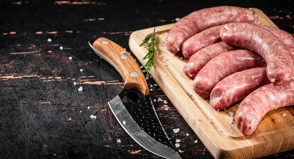 Raw Sausages Cutting Board Knife Rosemary Dark Background High Quality — Stok fotoğraf