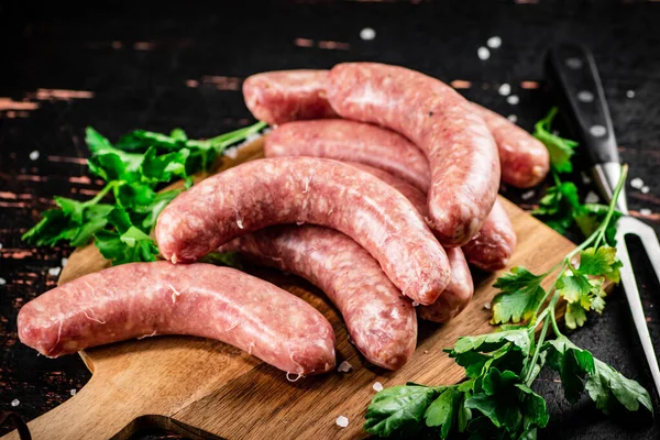 Raw Sausages Cutting Board Parsley Rustic Dark Background High Quality — Stok fotoğraf