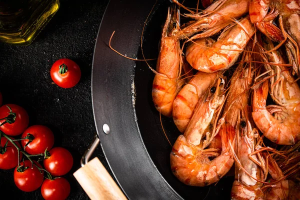 Shrimp Boiled Saucepan Sprig Tomatoes Black Background High Quality Photo — стоковое фото