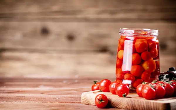 Pickled Ripe Tomatoes Glass Jar Wooden Background High Quality Photo — Stockfoto