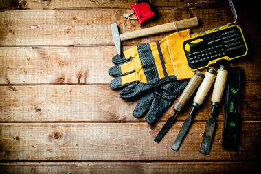 A set of construction tools on the table. On a wooden background. High quality photo