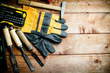 A set of construction tools on the table. On a wooden background. High quality photo