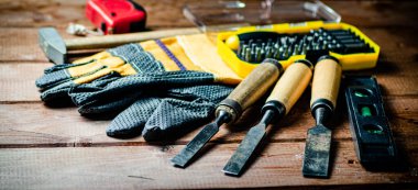 A set of construction tools on the table. On a wooden background. High quality photo