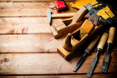 Various working tools on wood on the table. On a wooden background. High quality photo
