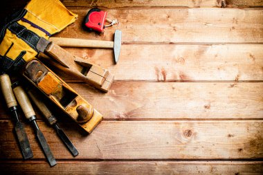 Various working tools on wood on the table. On a wooden background. High quality photo