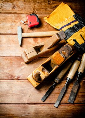 Various working tools on wood on the table. On a wooden background. High quality photo