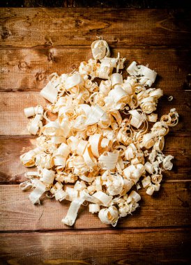 Wood chips on the table. On a wooden background. High quality photo