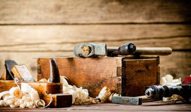 Various working tools on wood on the table. On a wooden background. High quality photo