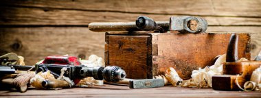 Various working tools on wood on the table. On a wooden background. High quality photo