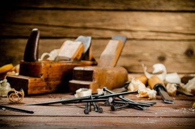 Construction nails on the table. On a wooden background. High quality photo