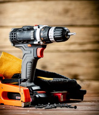 Working tool. Screwdriver. On a wooden background. High quality photo